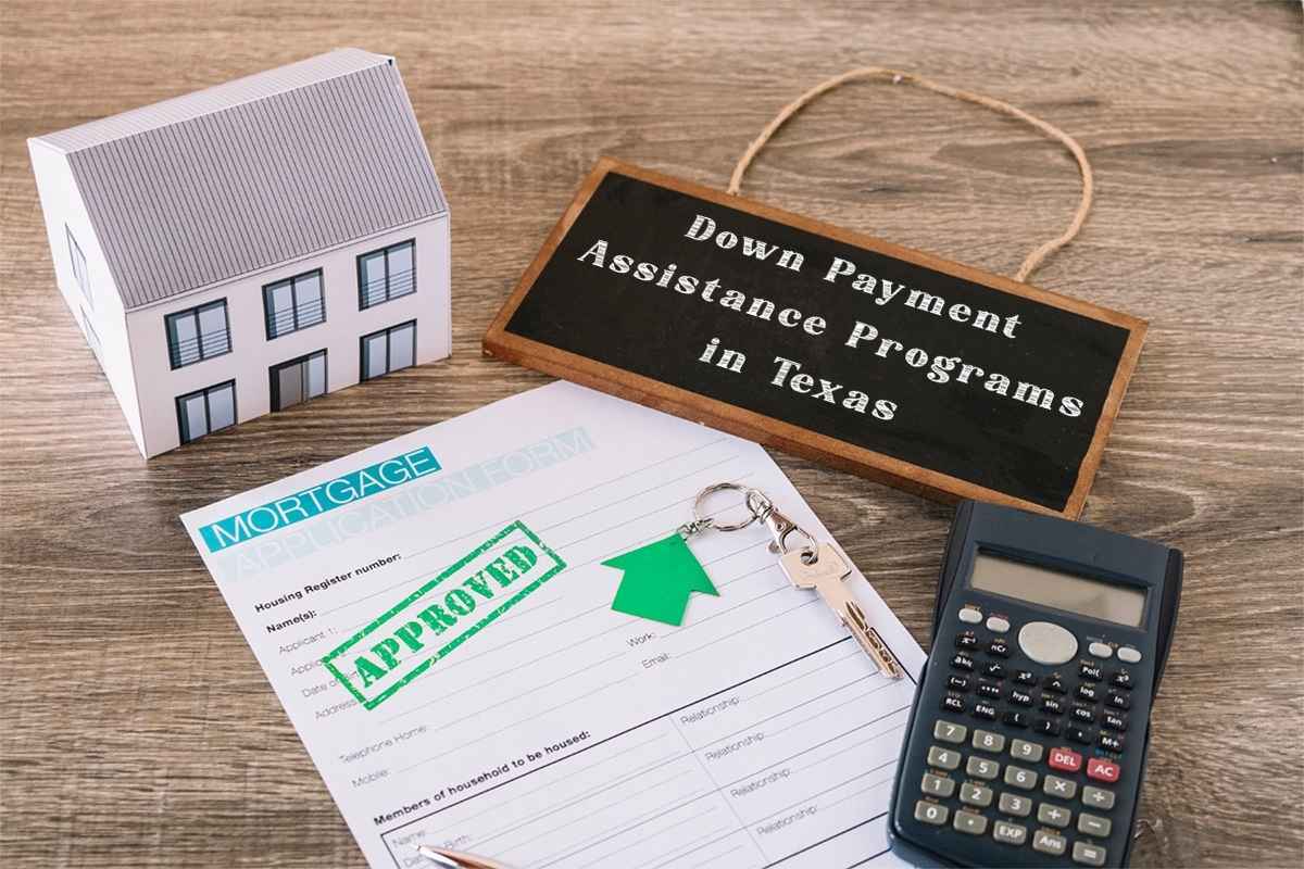 mortgage application papers on a table with a calculator and a small signboard stating 