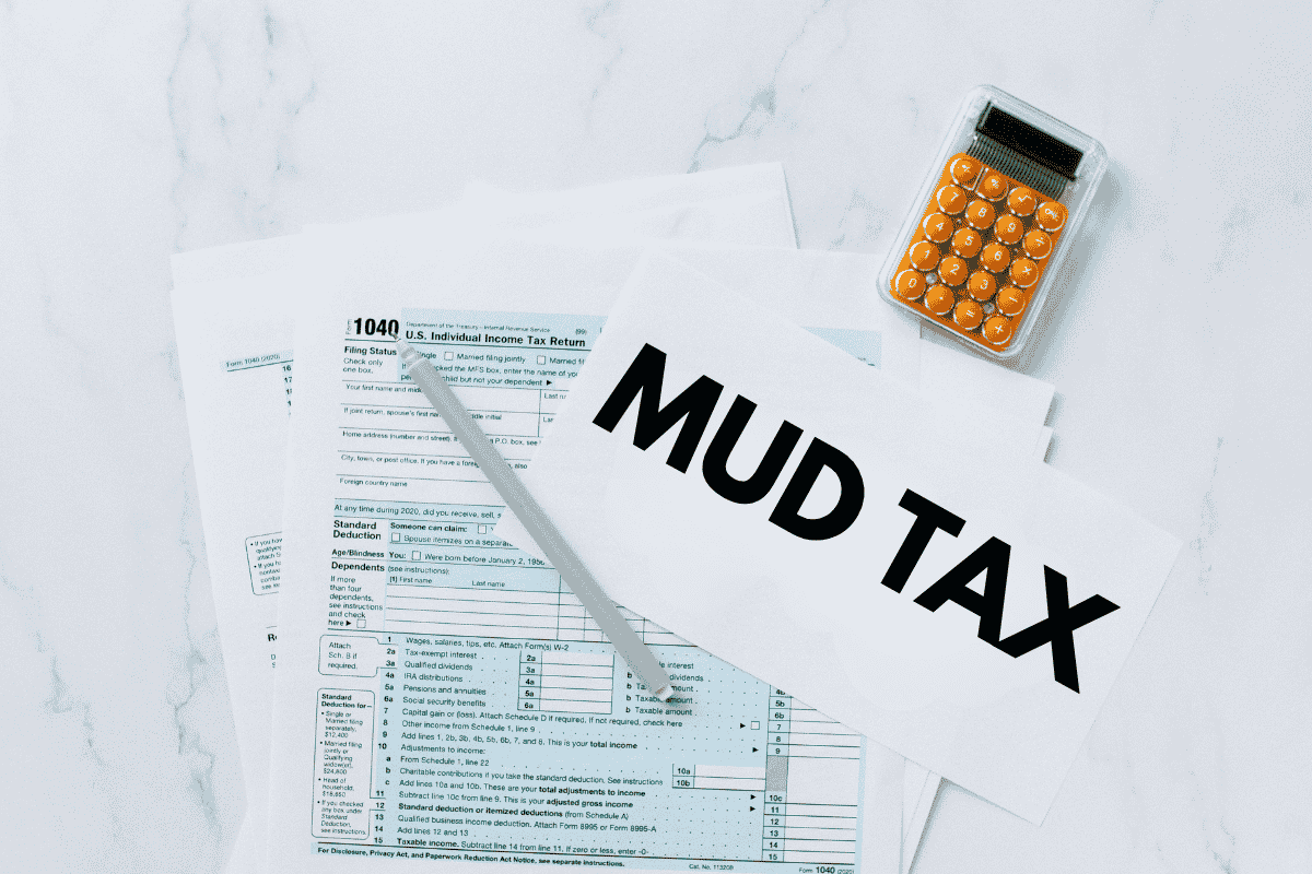 Tax forms for Texas homeowners, with a paper in front showing 